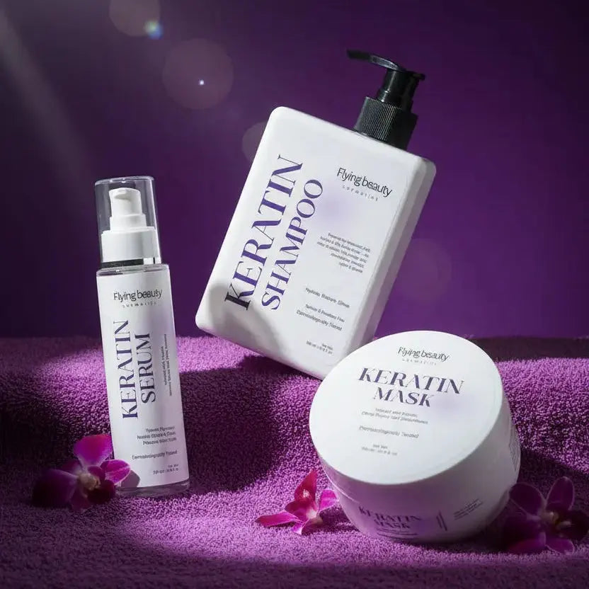 Keratin shampoo, conditioner, and mask on a purple background with flowers.